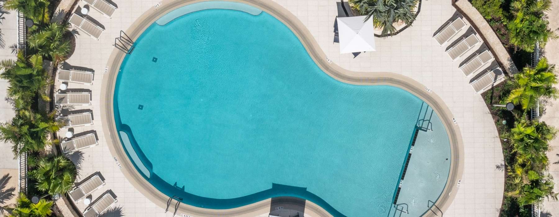 Overhead drone view of the swimming pool deck and courtyards at Shalimar at Boynton Beach.